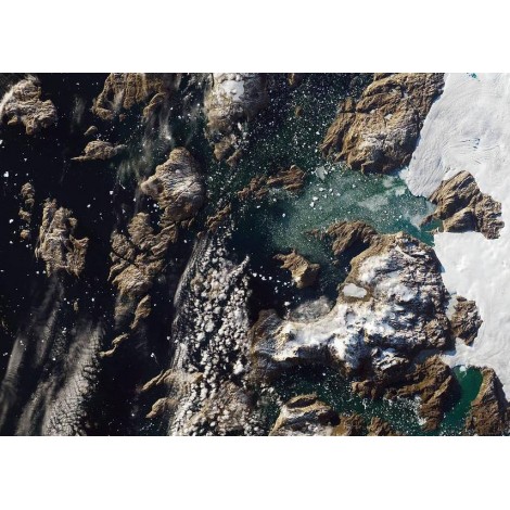 Iceberg Towers Over Greenland Village